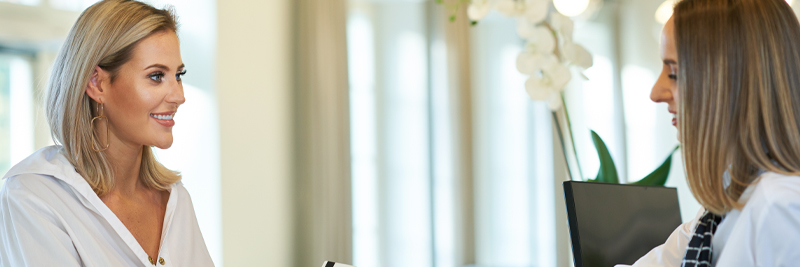 Hotel guest interacting with front desk