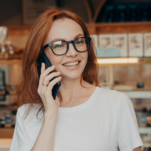 woman on phone in coffee shop