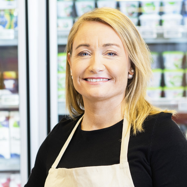 smiling convenience store worker