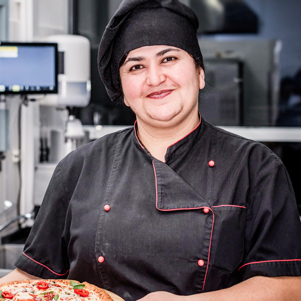 pizza chef holding pizza