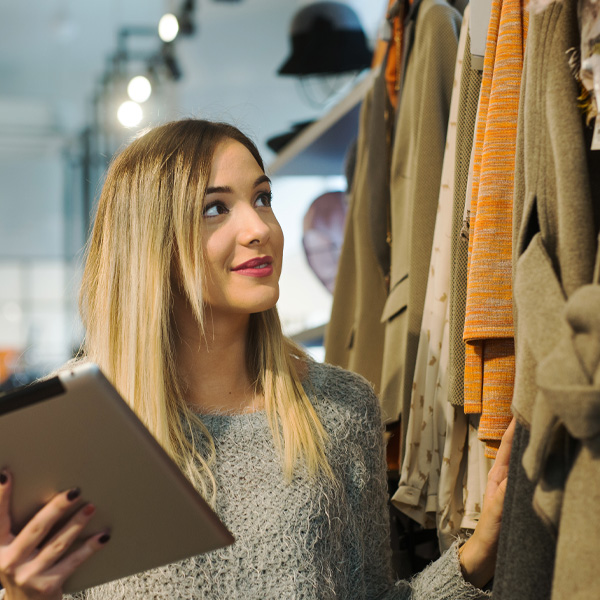 retail worker inspecting inventory<br />
